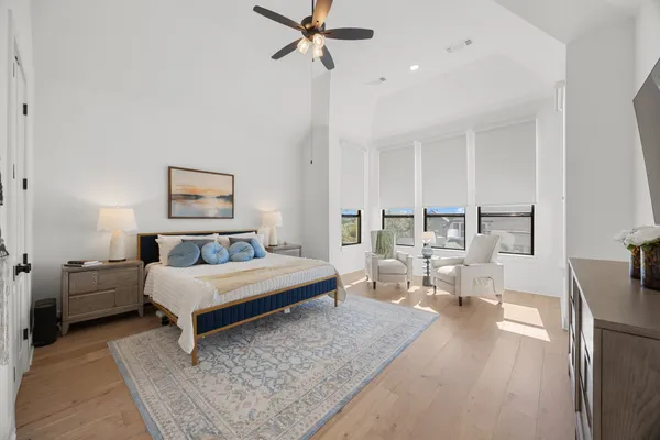 a en suite bathroom with a double vanity sink mirror and bathtub