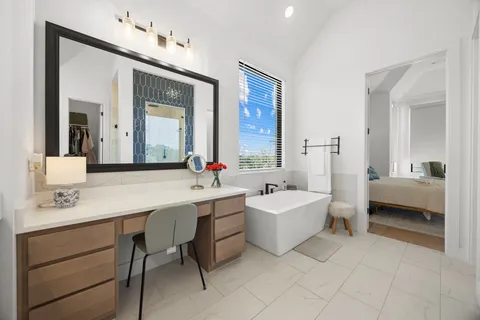a spacious bedroom with a bed and a couch