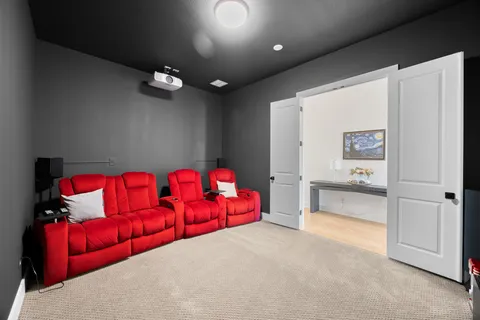 a living room with furniture and a baby crib