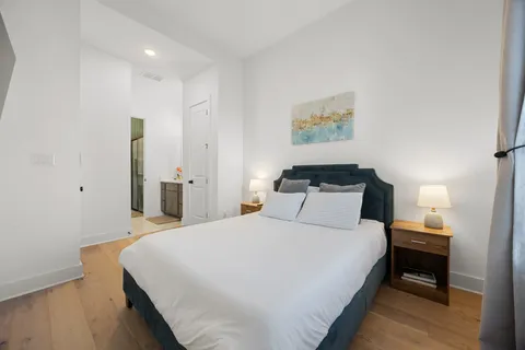 a bathroom with a sink a toilet a shower curtain and a bath tub