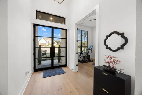 a kitchen with stainless steel appliances granite countertop a sink a stove and cabinets