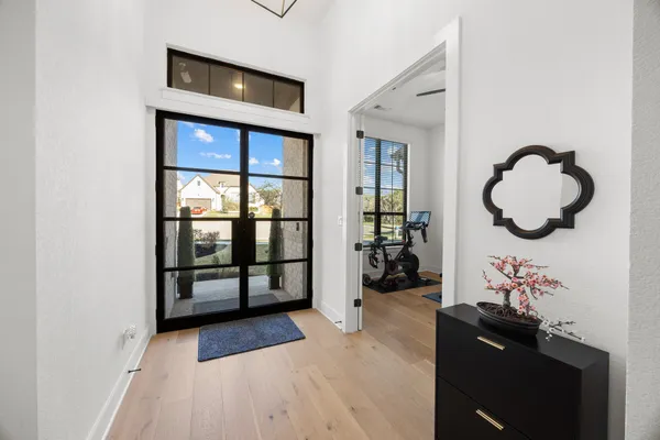 a kitchen with stainless steel appliances granite countertop a sink a stove and cabinets