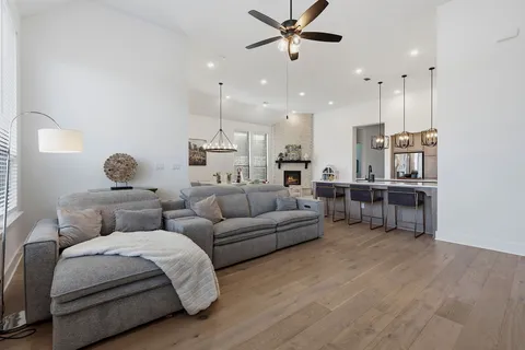 a spacious bedroom with a bed and a couch