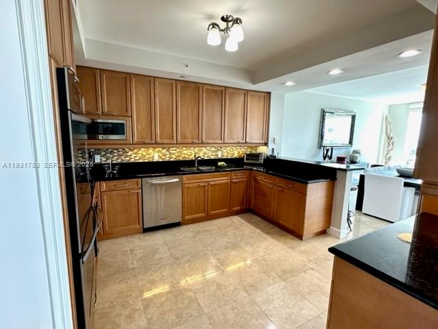 20201 East Country Club Drive, Unit 903 Aventura, FL 33180 - Photo 23 of 61 a kitchen with a sink stove and cabinets