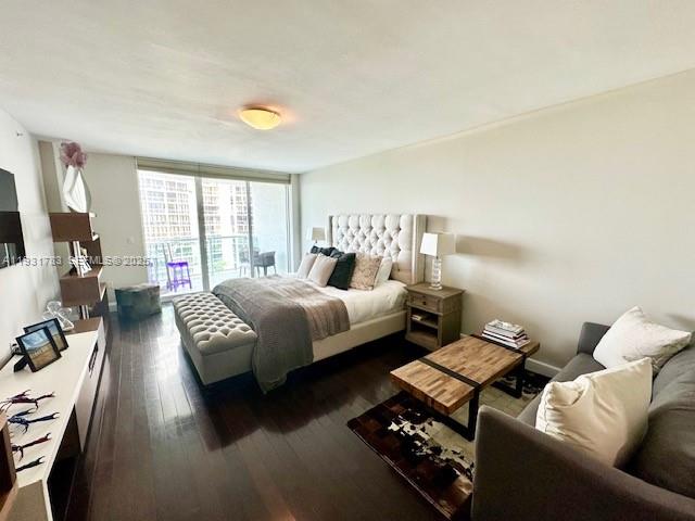 20201 East Country Club Drive, Unit 903 Aventura, FL 33180 - Photo 28 of 61 a bedroom with a bed couch and a window