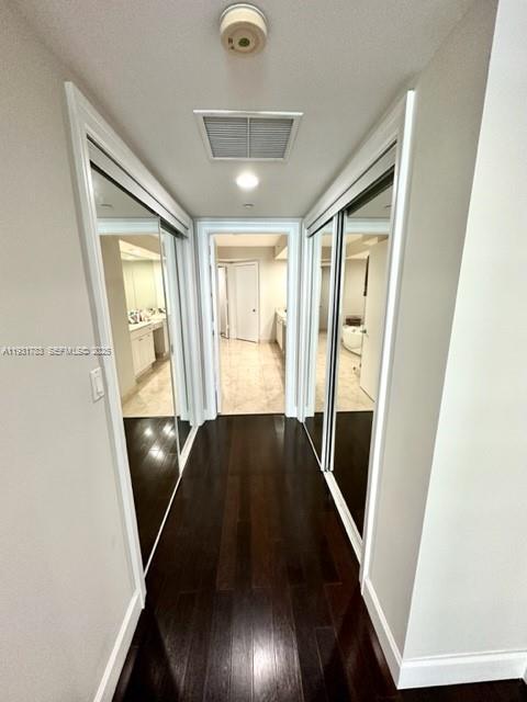 20201 East Country Club Drive, Unit 903 Aventura, FL 33180 - Photo 29 of 61 a view of entryway and hall with wooden floor