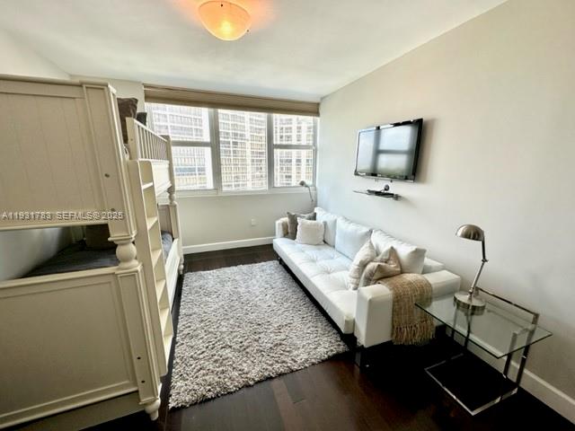 20201 East Country Club Drive, Unit 903 Aventura, FL 33180 - Photo 48 of 61 a living room with furniture and a flat screen tv