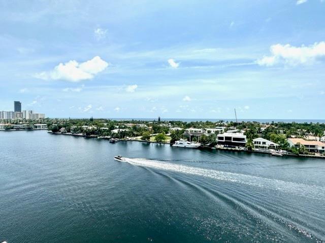 20201 East Country Club Drive, Unit 903 Aventura, FL 33180 - Photo 53 of 61 a view of a lake with boats and trees