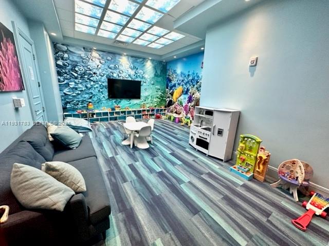 20201 East Country Club Drive, Unit 903 Aventura, FL 33180 - Photo 61 of 61 a living room with furniture and a flat screen tv