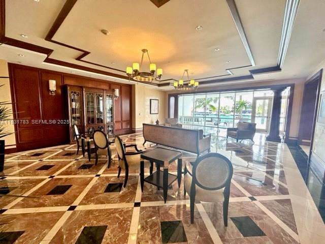 20201 East Country Club Drive, Unit 903 Aventura, FL 33180 - Photo 7 of 61 a very nice looking dining room with a large glass table and chairs