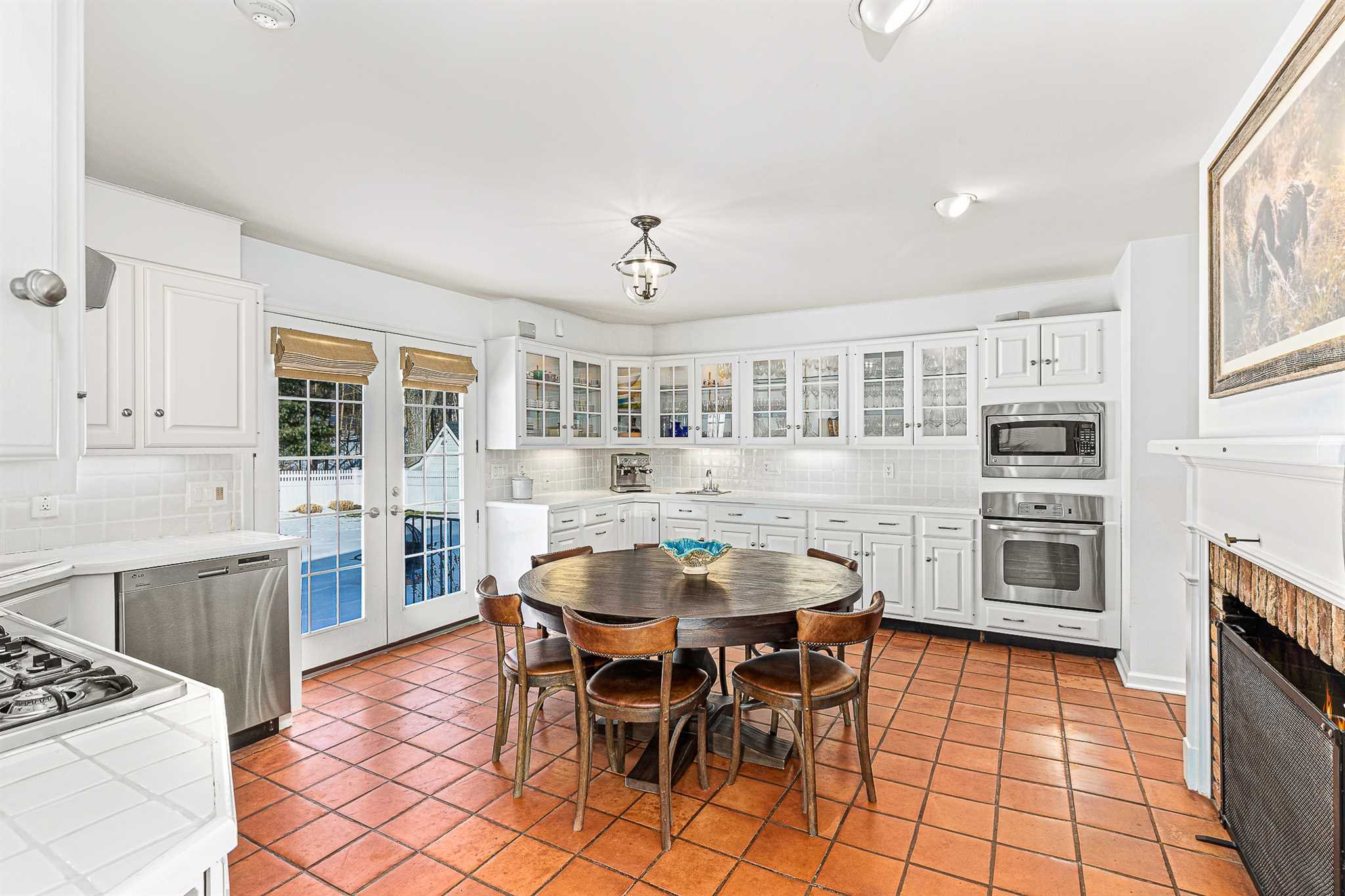 49 Linden Lane Millbrook, NY 12545 - Photo 12 of 29 a view of a dining room with furniture and a kitchen