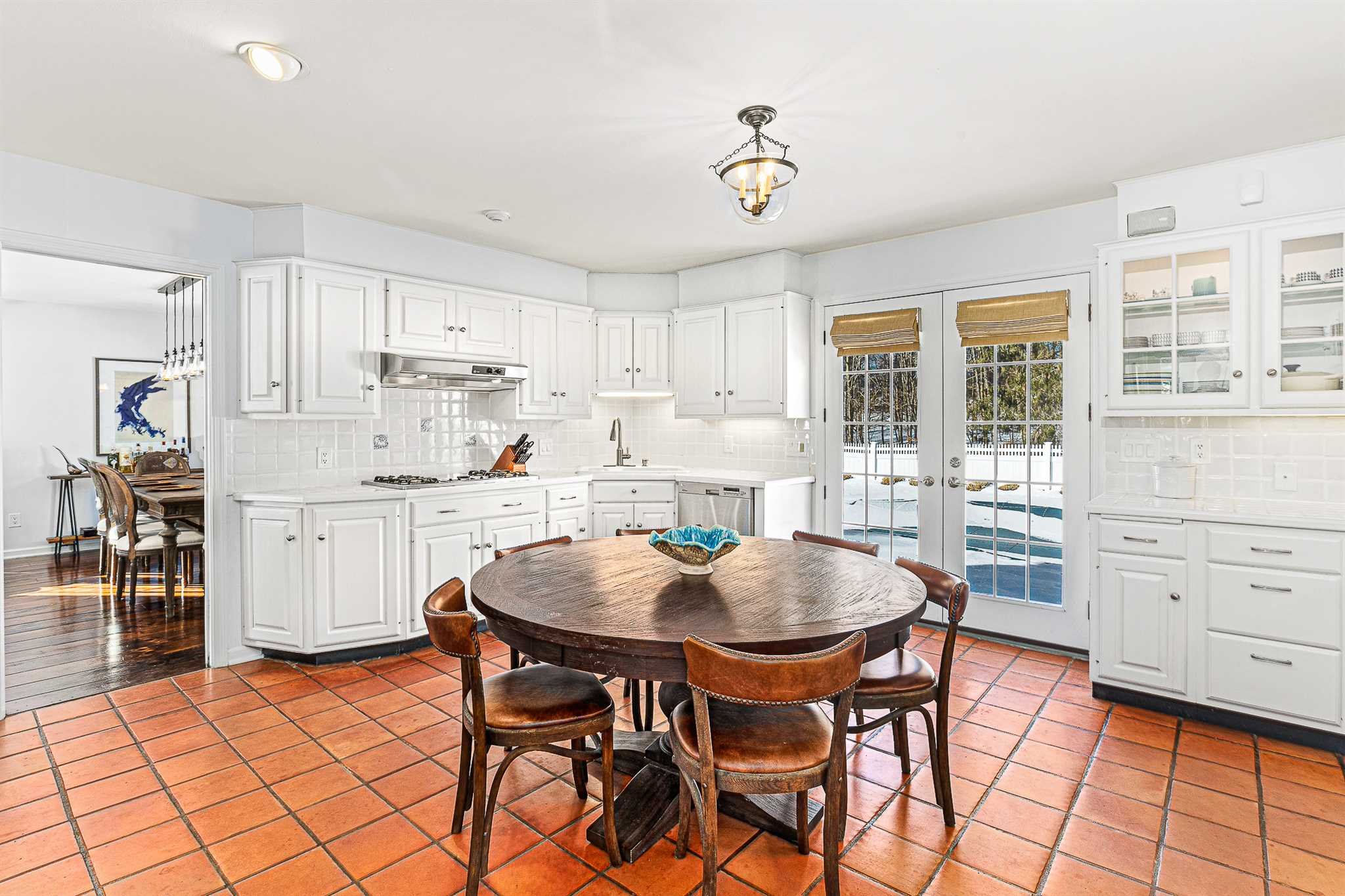 49 Linden Lane Millbrook, NY 12545 - Photo 14 of 29 a kitchen with stainless steel appliances kitchen island granite countertop a dining table chairs and white cabinets