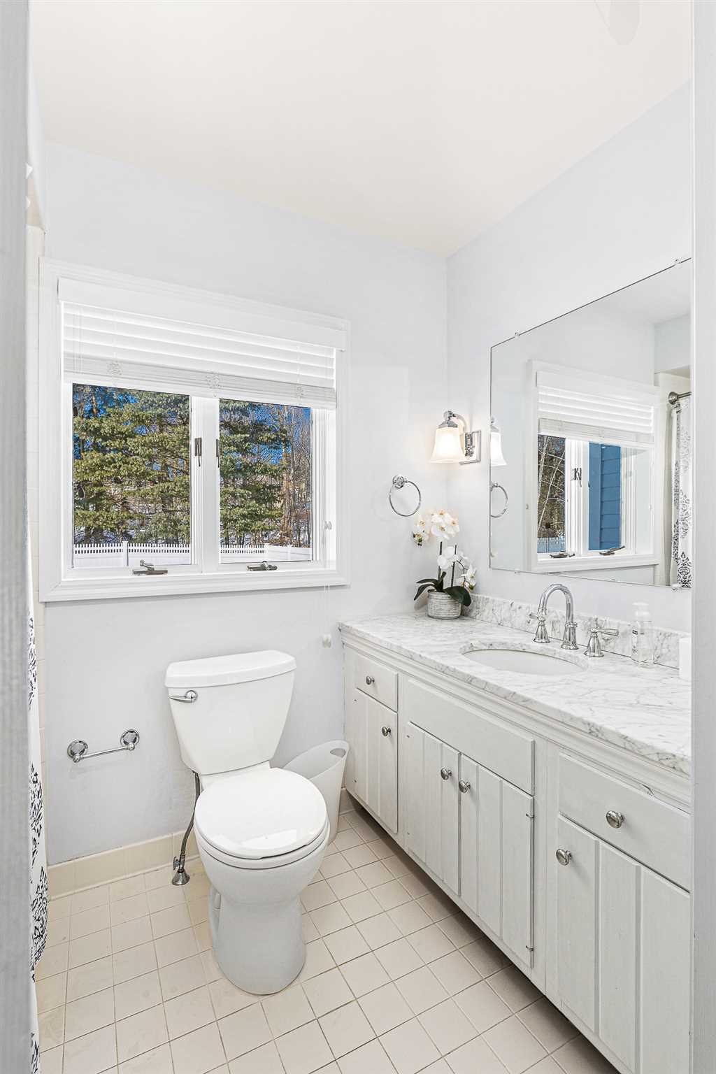 49 Linden Lane Millbrook, NY 12545 - Photo 18 of 29 a spacious bathroom with a toilet a sink a window and mirror