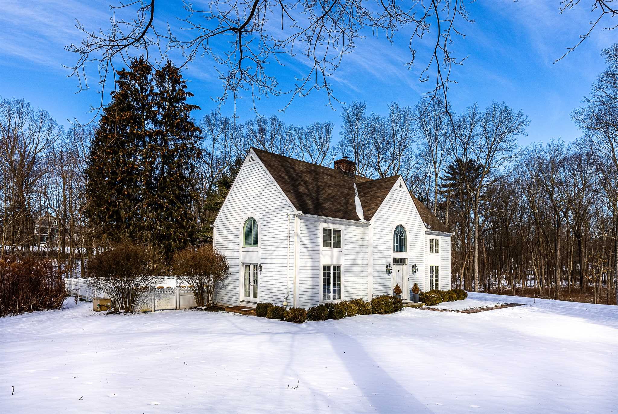 49 Linden Lane Millbrook, NY 12545 - Photo 4 of 29 a view of a white house with a yard and large trees