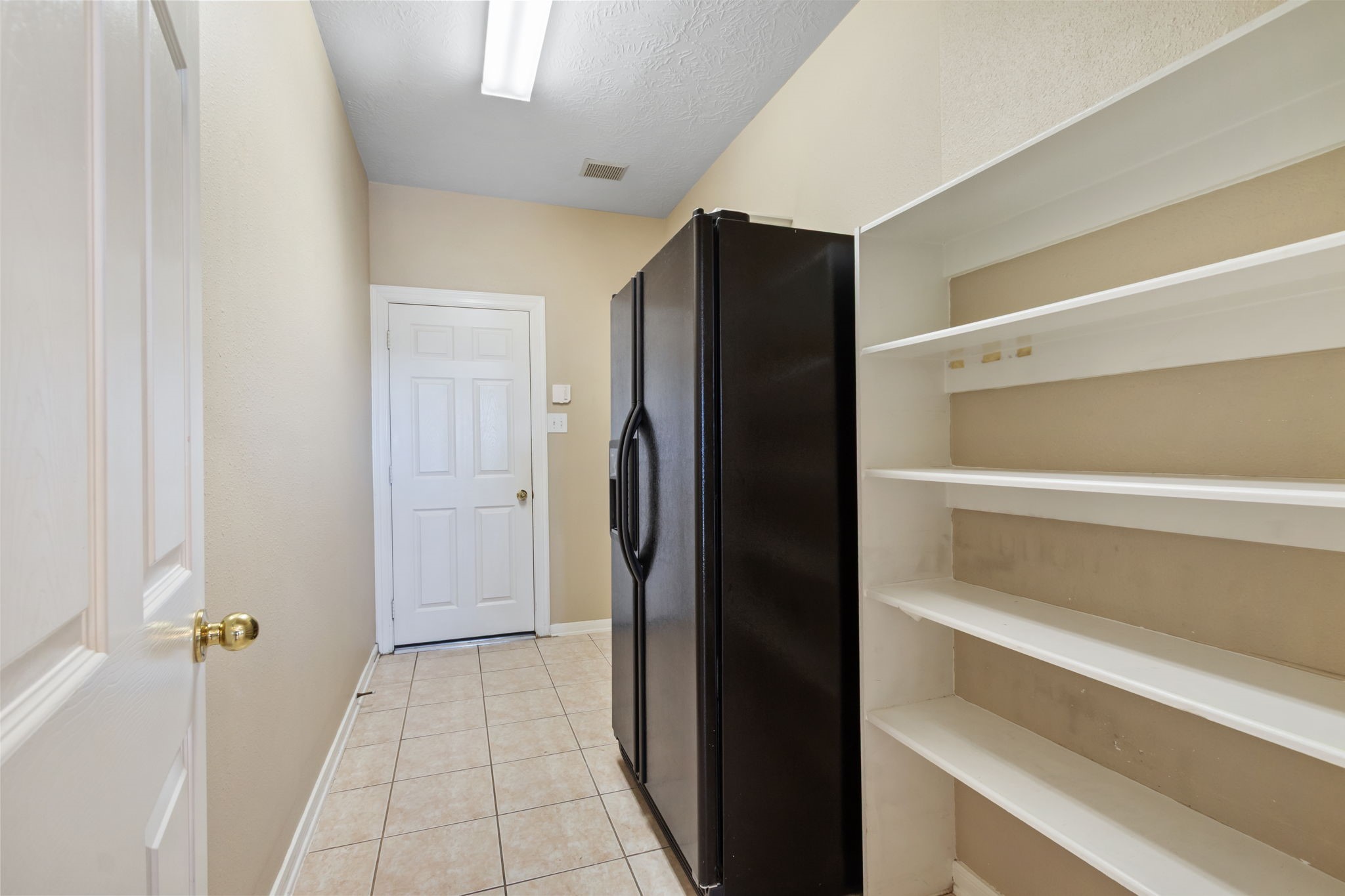 6311 Stone Trail Lane Spring, TX 77379 - Photo 18 of 47 This utility room is huge! Make the most of your Costco runs and fill a second fridge and more storage shelves!