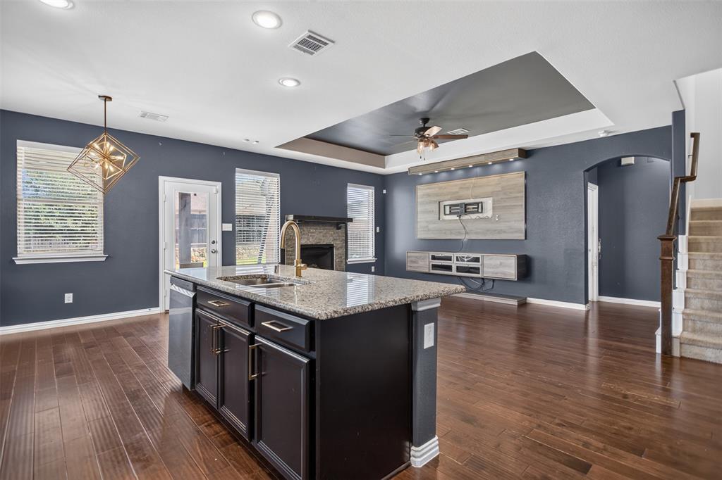 2066 Avondown Road Forney, TX 75126 - Photo 15 of 33 Kitchen island with granite countertop and undermount sink