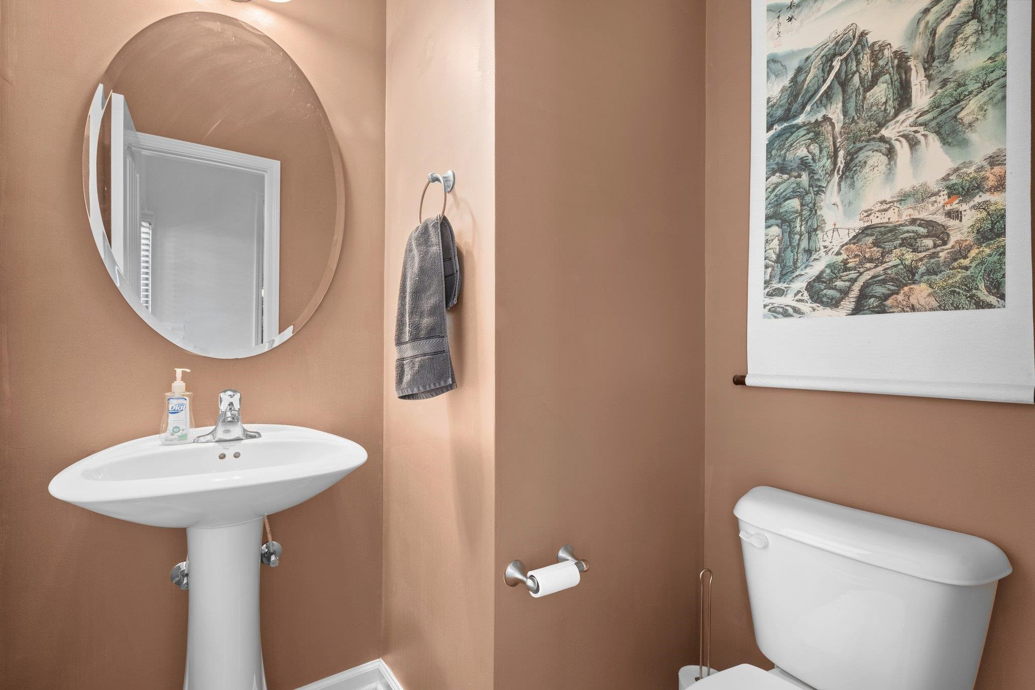 104 Griffis Drive Stem, NC 27581 - Photo 14 of 37 a bathroom with a toilet sink and mirror