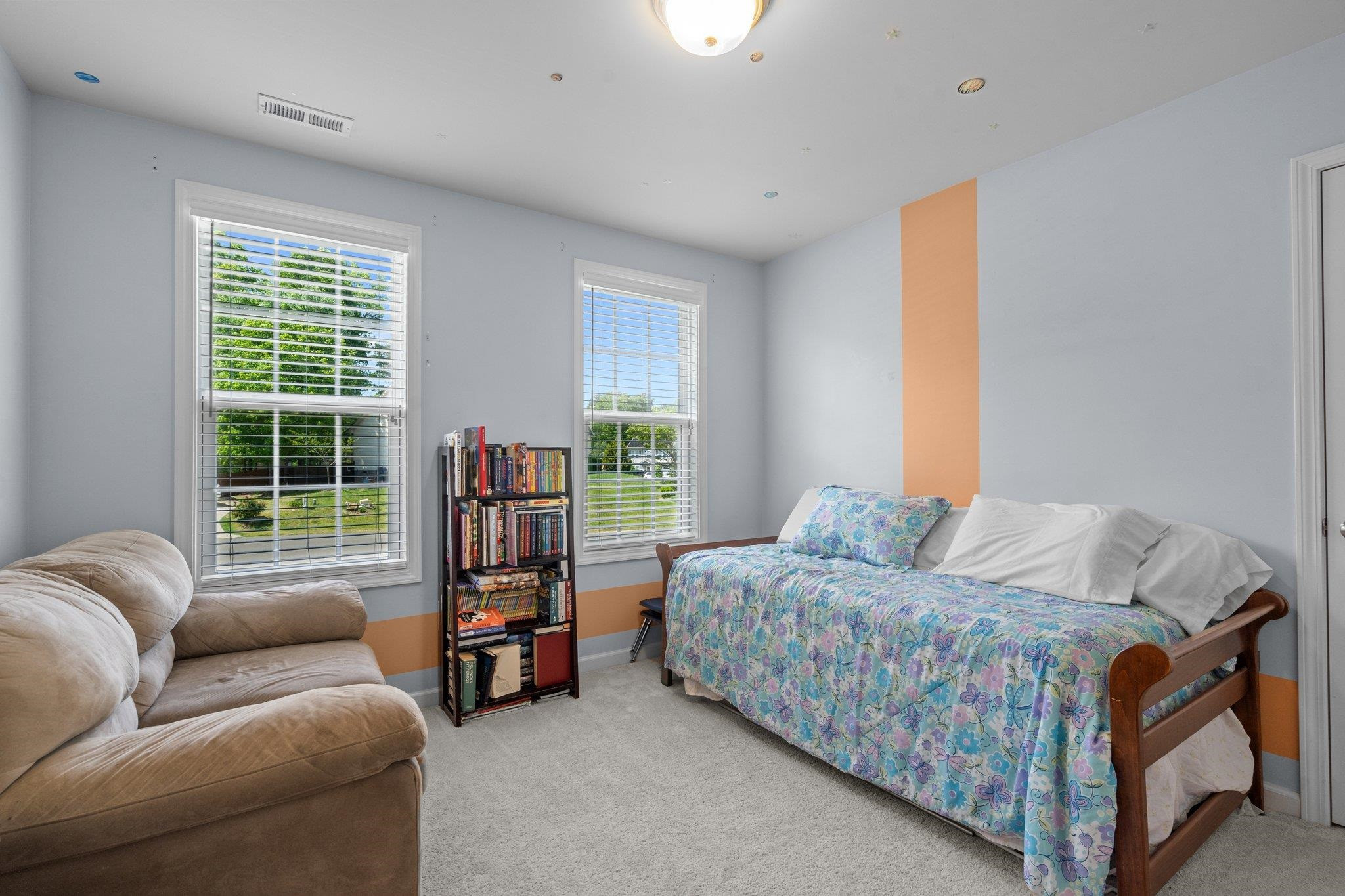 104 Griffis Drive Stem, NC 27581 - Photo 21 of 37 a bedroom with furniture and a large window