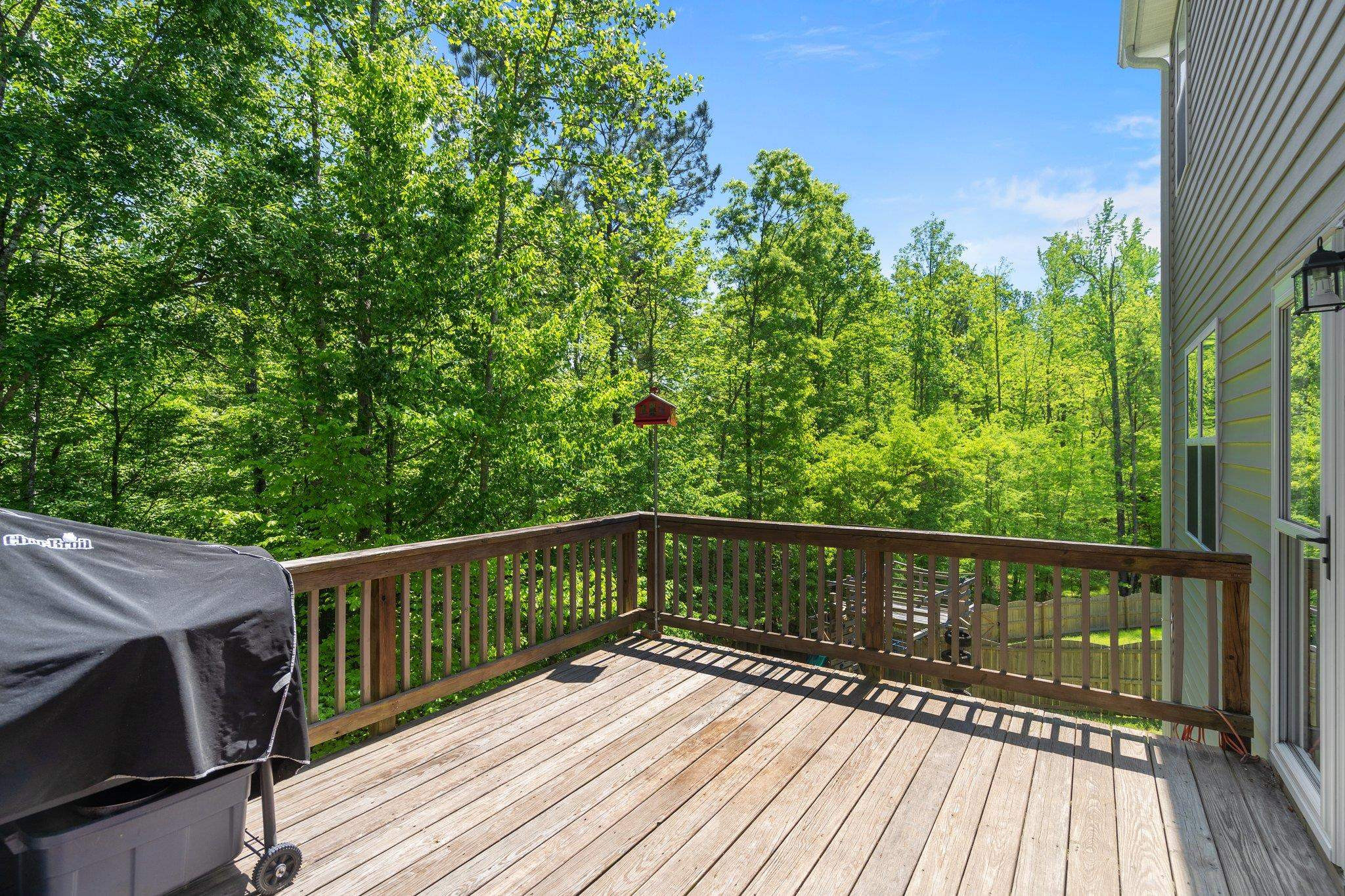 104 Griffis Drive Stem, NC 27581 - Photo 26 of 37 a view of deck with wooden floor and outdoor seating