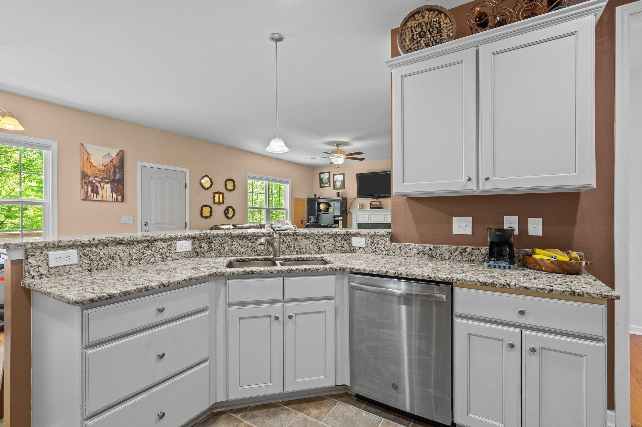 104 Griffis Drive Stem, NC 27581 - Photo 8 of 37 a kitchen with granite countertop white cabinets and white appliances