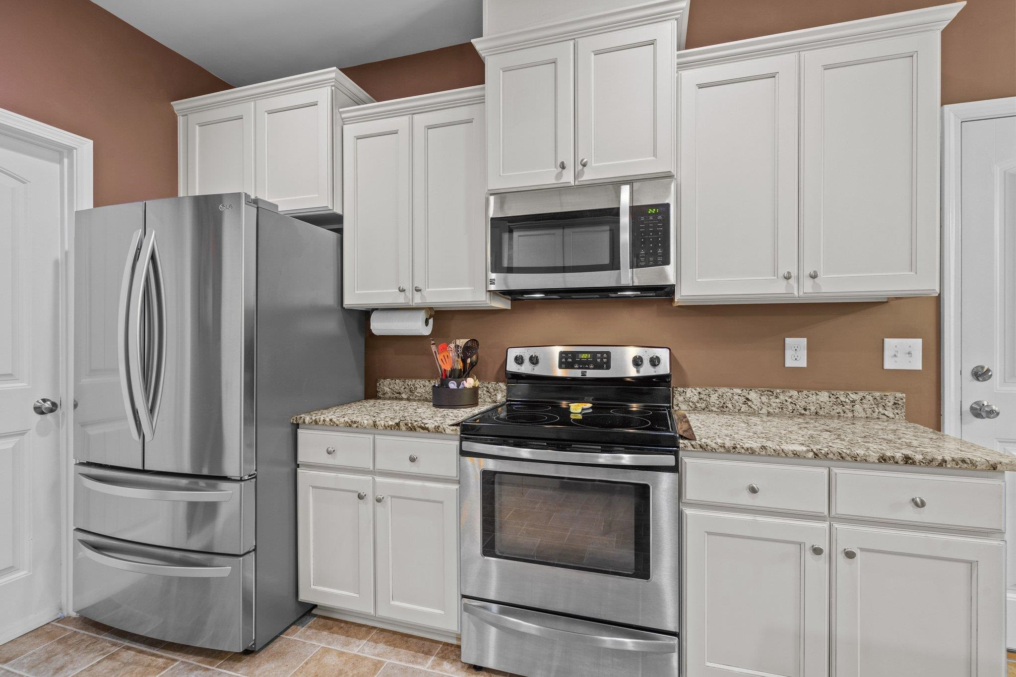 104 Griffis Drive Stem, NC 27581 - Photo 9 of 37 a kitchen with cabinets stainless steel appliances and a counter space