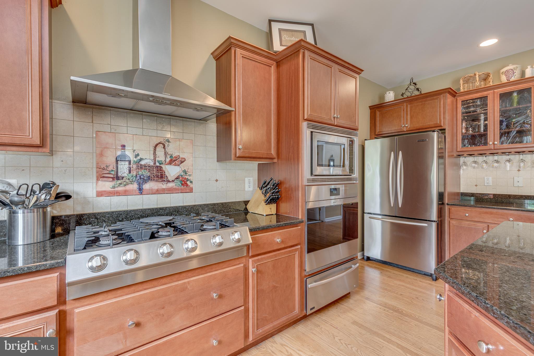 2 Dellaira Court Wrightstown, NJ 08562 - Photo 19 of 93 a kitchen with stainless steel appliances granite countertop a stove and a refrigerator