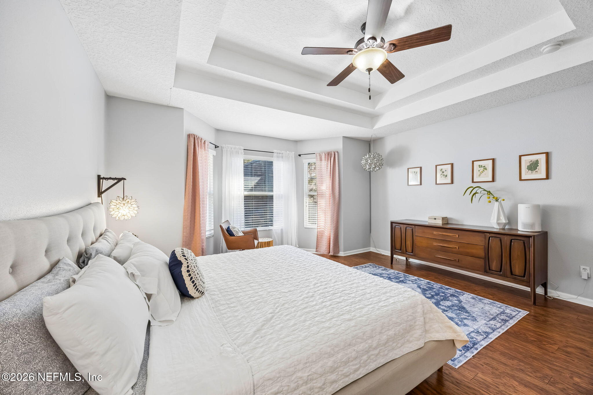 1624 Indigo Street Fernandina Beach, FL 32034 - Photo 13 of 22 a bedroom with a bed and a chandelier