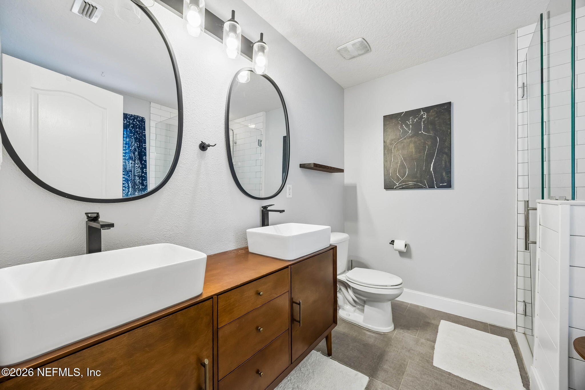 1624 Indigo Street Fernandina Beach, FL 32034 - Photo 14 of 22 a bathroom with a toilet a sink and a mirror