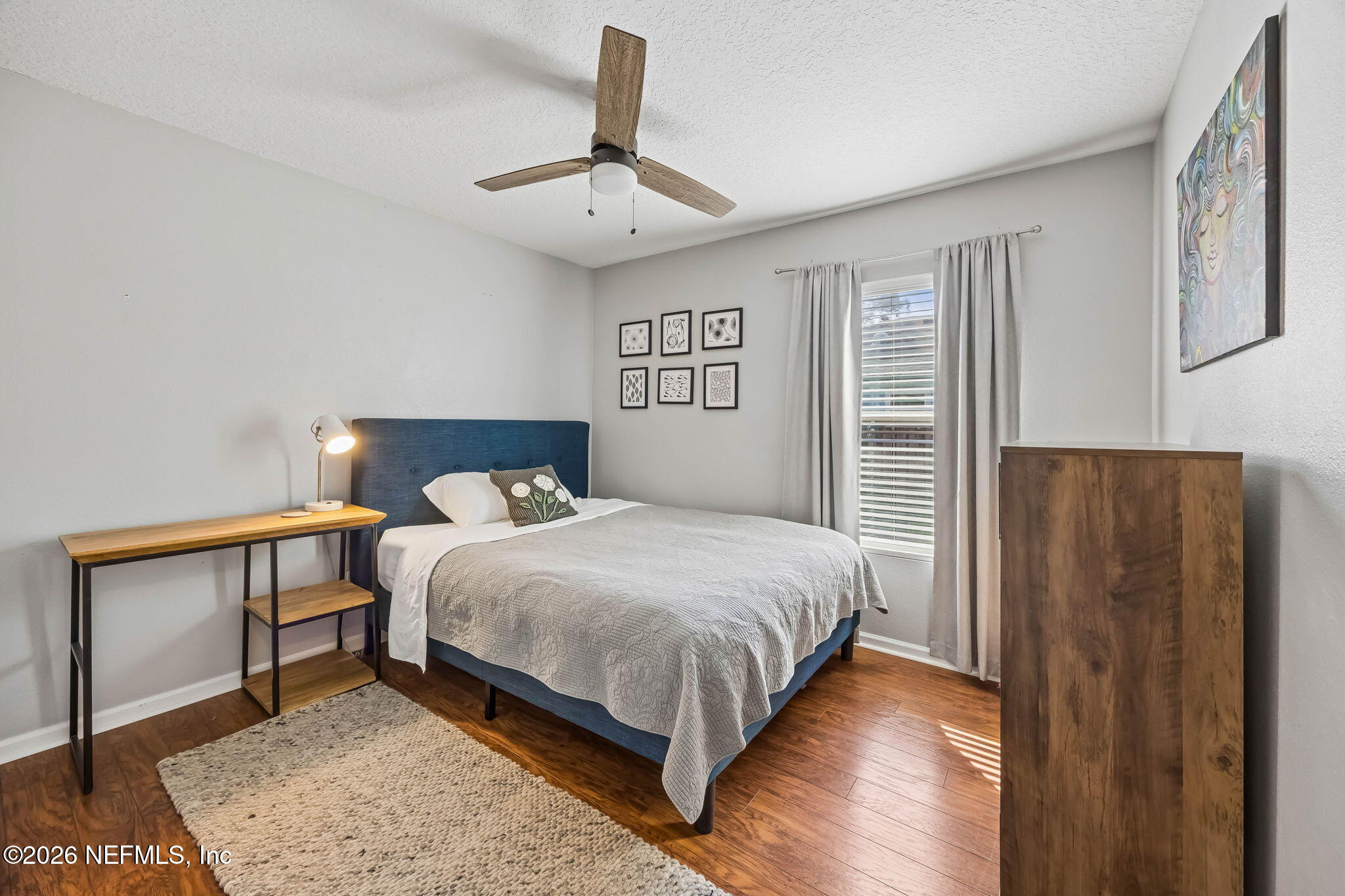 1624 Indigo Street Fernandina Beach, FL 32034 - Photo 16 of 22 a bedroom with a bed and a table