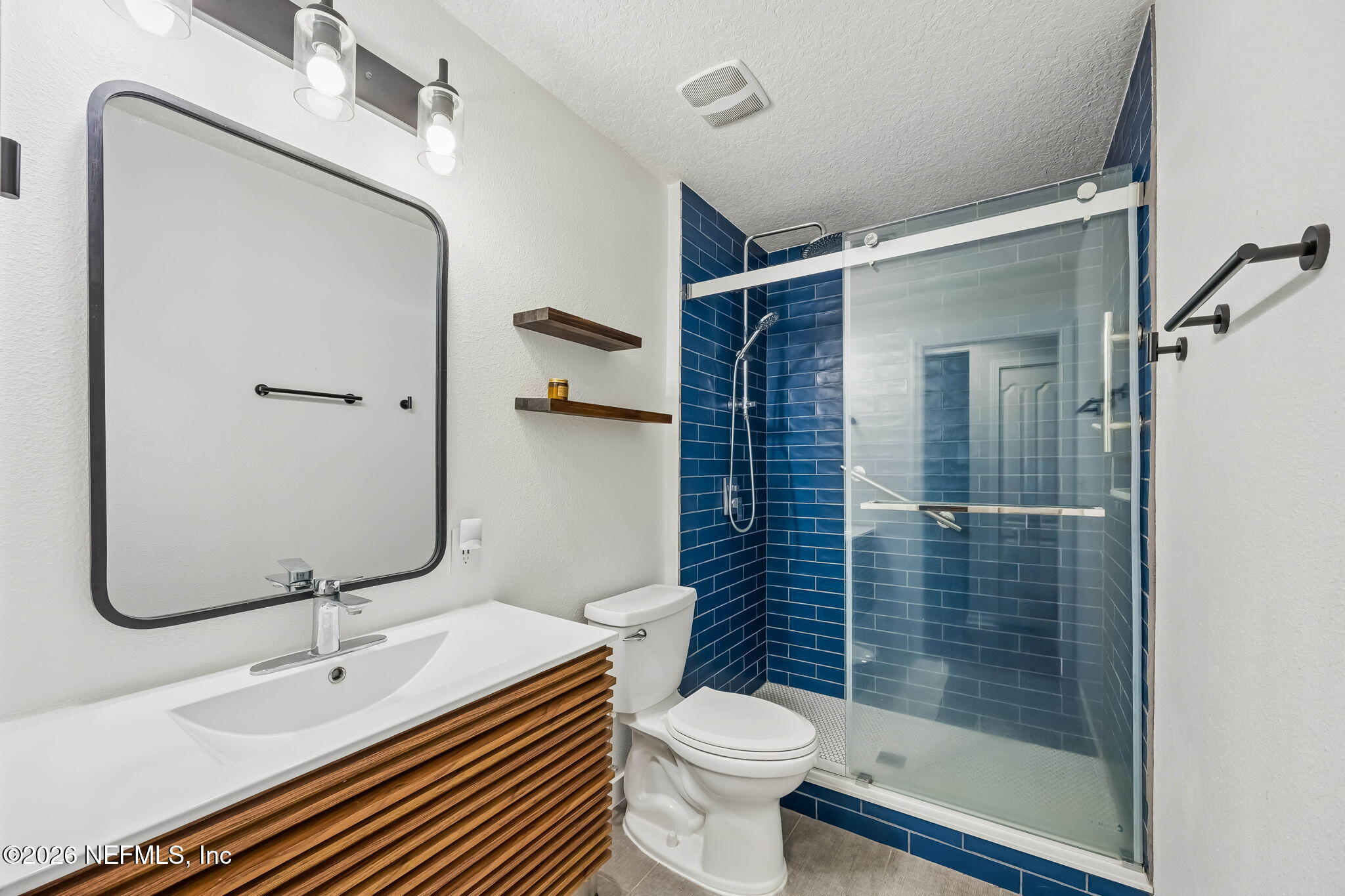 1624 Indigo Street Fernandina Beach, FL 32034 - Photo 17 of 22 a bathroom with a sink a toilet and shower