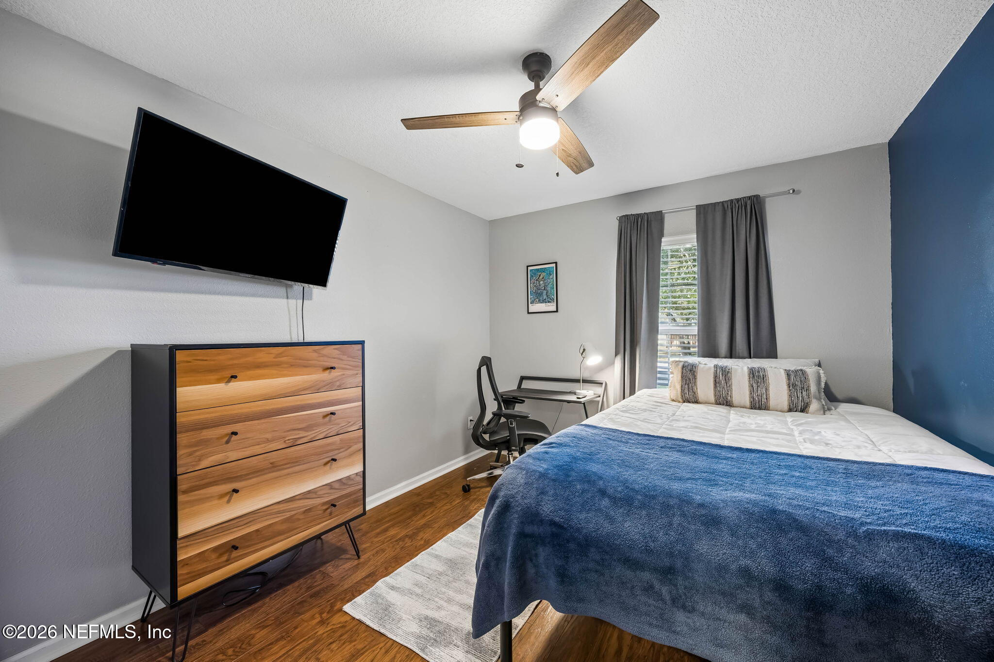 1624 Indigo Street Fernandina Beach, FL 32034 - Photo 18 of 22 a bedroom with a bed and a flat screen tv