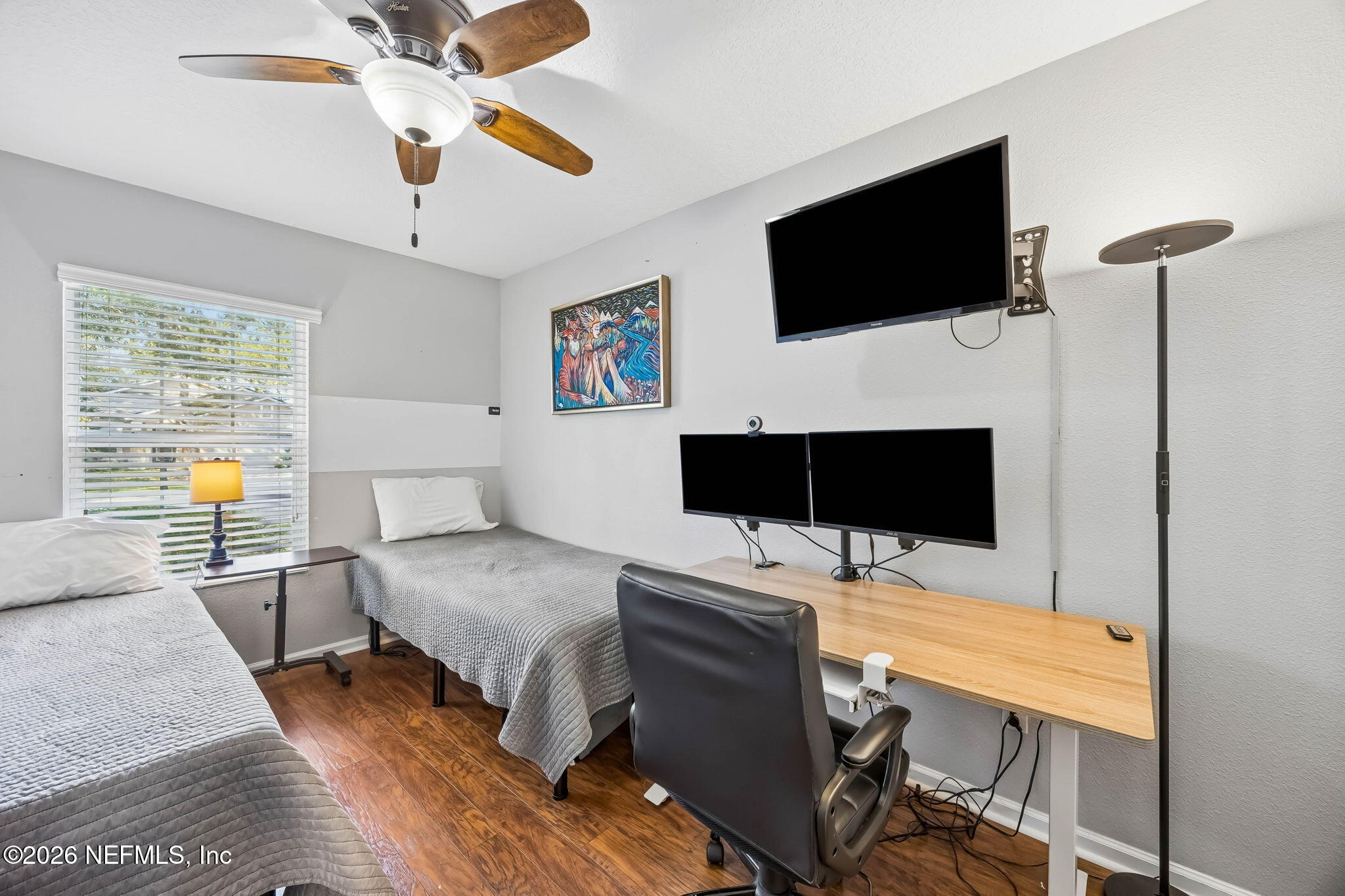 1624 Indigo Street Fernandina Beach, FL 32034 - Photo 19 of 22 a bedroom with a bed and a flat screen tv