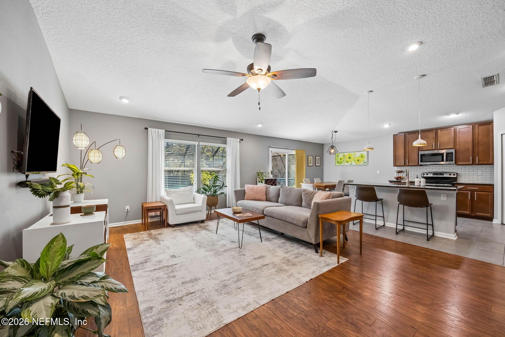 1624 Indigo Street Fernandina Beach, FL 32034 - Photo 3 of 22 a living room with furniture flat screen tv and large window
