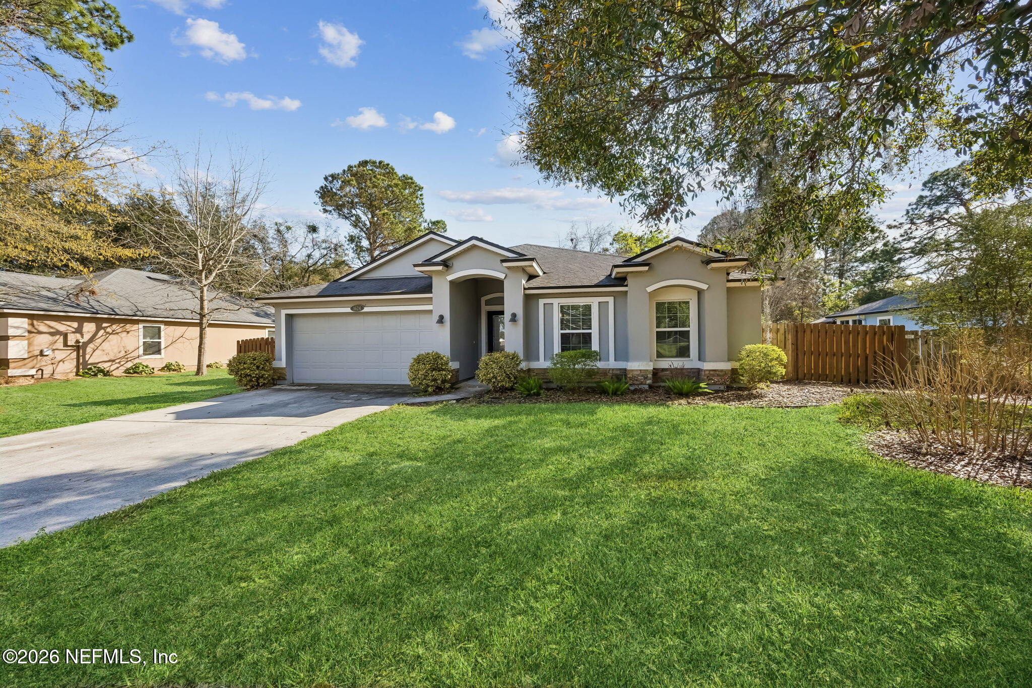 1624 Indigo Street Fernandina Beach, FL 32034 - Photo 5 of 22 a front view of a house with a garden