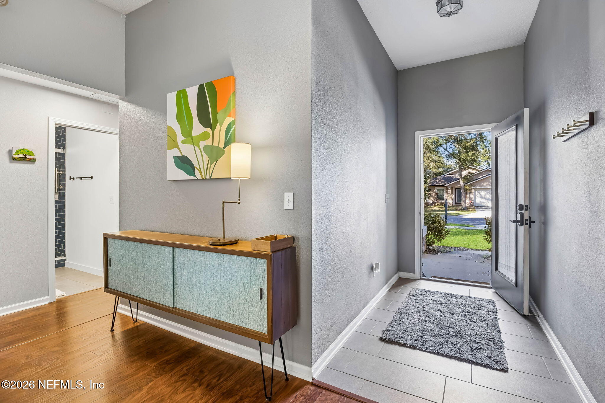 1624 Indigo Street Fernandina Beach, FL 32034 - Photo 6 of 22 a view of a hallway with wooden floor and a rug