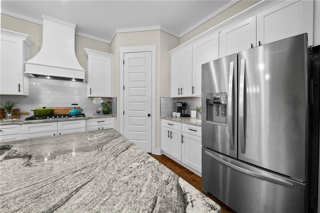 392 London Road Ball Ground, GA 30107 - Photo 3 of 53 a kitchen with stainless steel appliances a refrigerator sink and stove