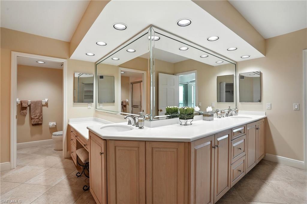 20 Seagate Drive, Unit 803 Naples, FL 34103 - Photo 28 of 40 Bathroom with double vanity, recessed lighting, and light tile patterned floors