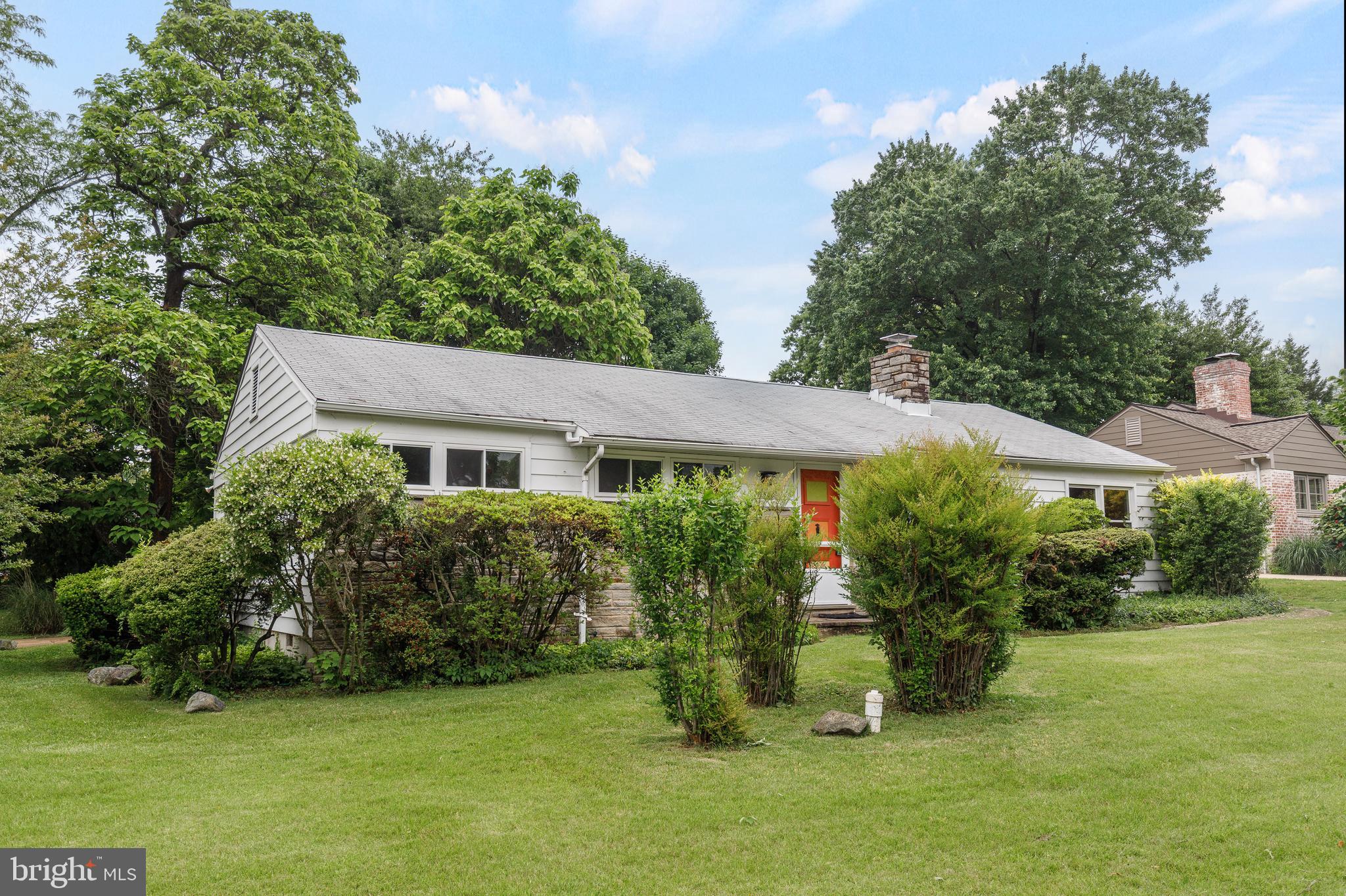 7500 Rocksham Drive Towson, MD 21286 - Photo 2 of 26 a front view of a house with a garden