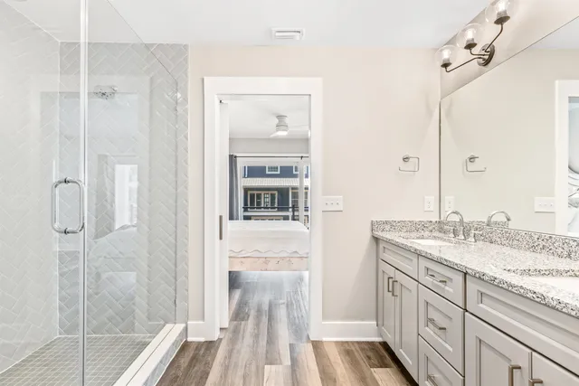 a bathroom with a granite countertop sink a mirror and a