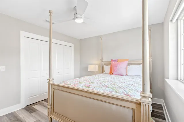 a bed room with a bed and a chair