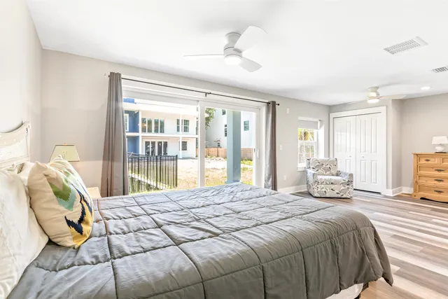 a view of a livingroom with wooden floor and stairs