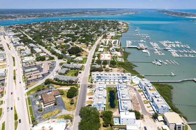 an aerial view of a city with lake view