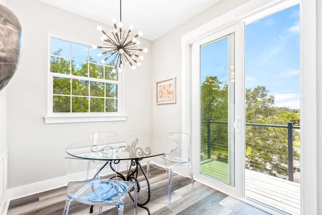 a view of balcony with wooden floor and fence