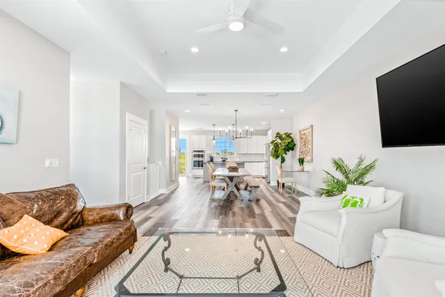 a balcony with wooden floor and breakfast area