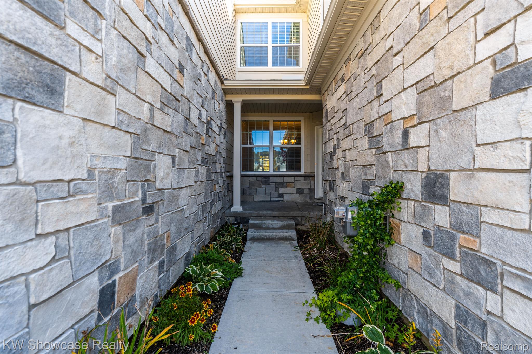42768 Cardinal Way Novi, MI 48375 - Photo 3 of 42 The Entry Walkway is private and secure.