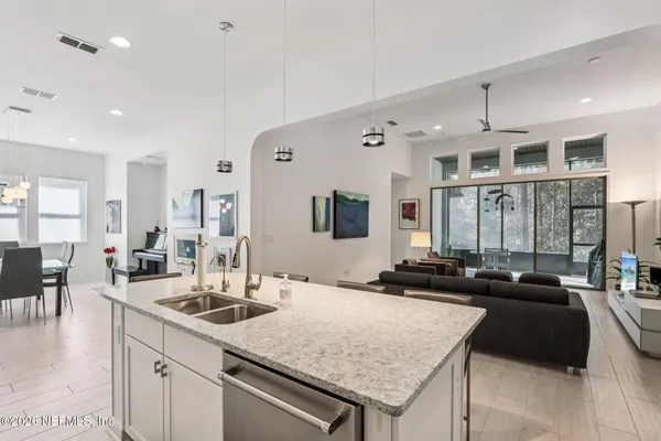 a large kitchen with a table and chairs