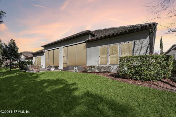 a backyard of a house with lots of green space