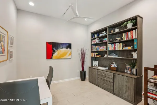 a bedroom with a bed and a table in it
