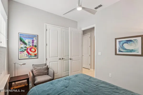 a bedroom with a bed and furniture