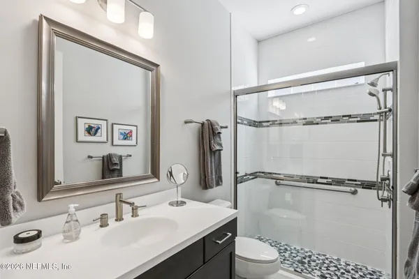 a bathroom with a double vanity sink mirror and double